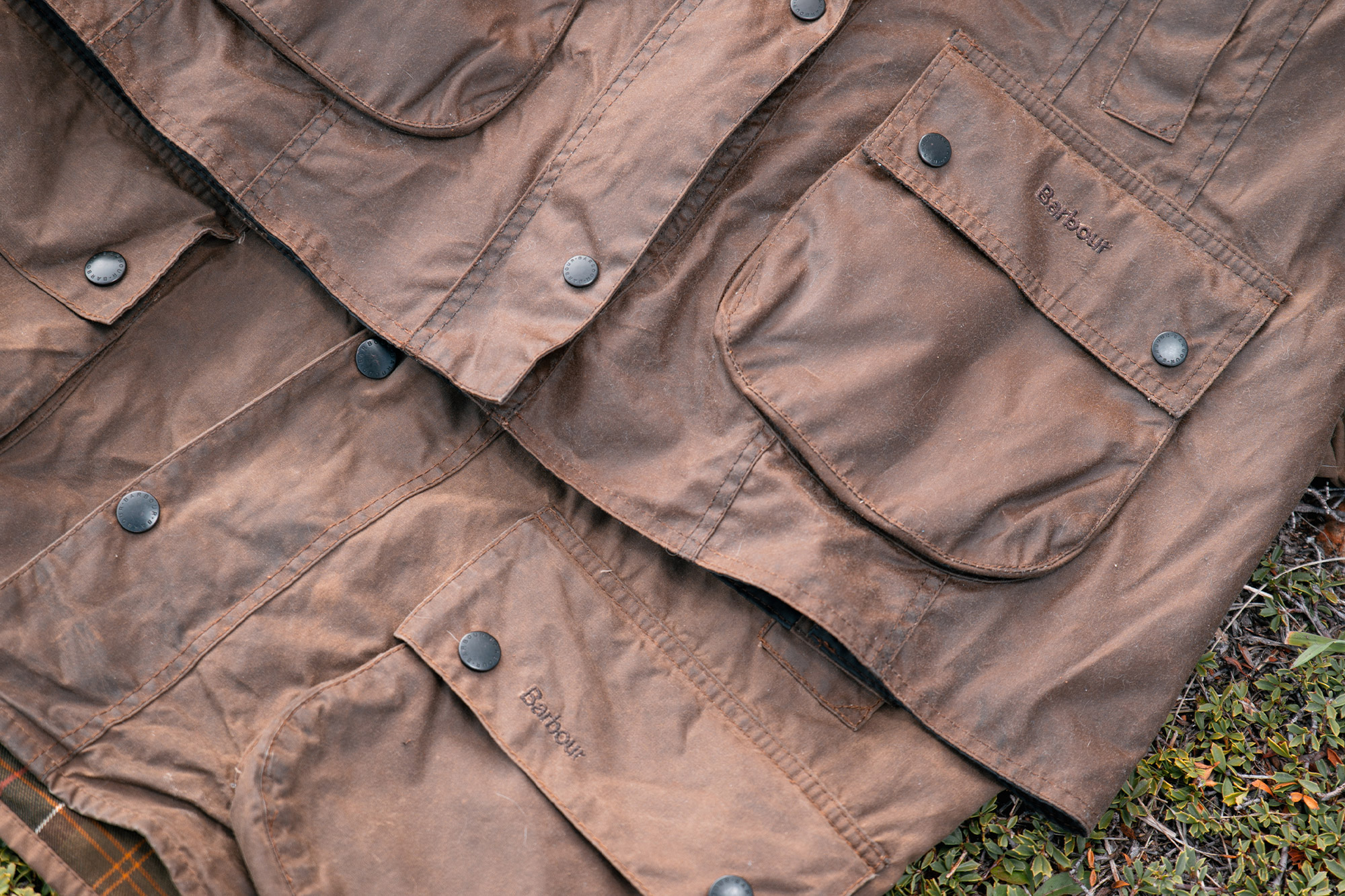 Two waxed fabric finishes compared side by side, including material used on the Barbour Beaufort Wax Jacket