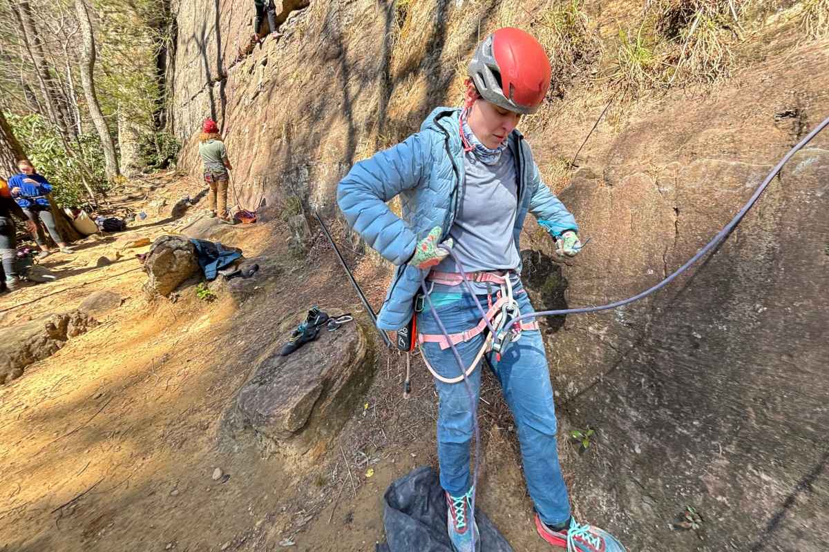 climber adjusting jacket outside