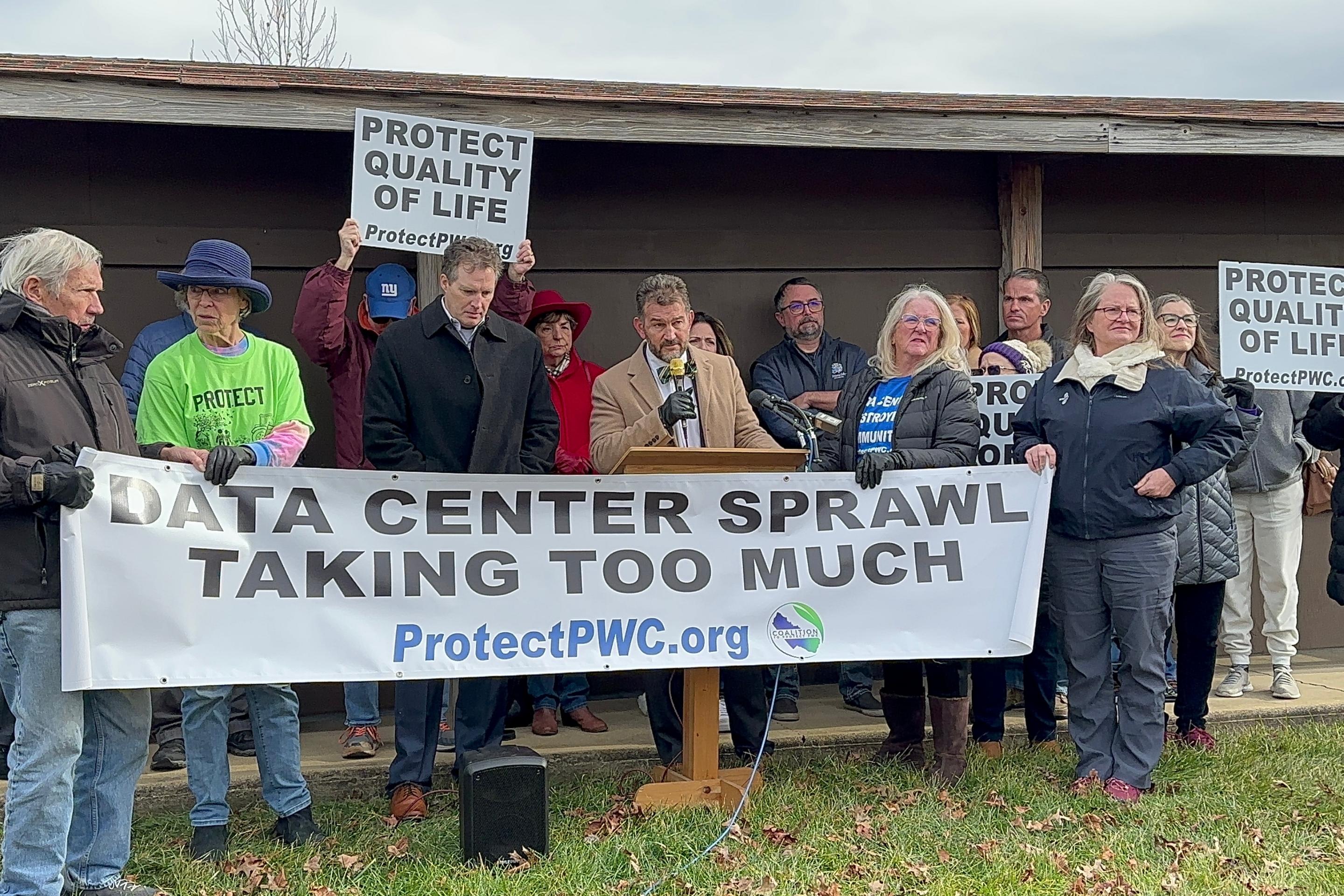 people rally with signs