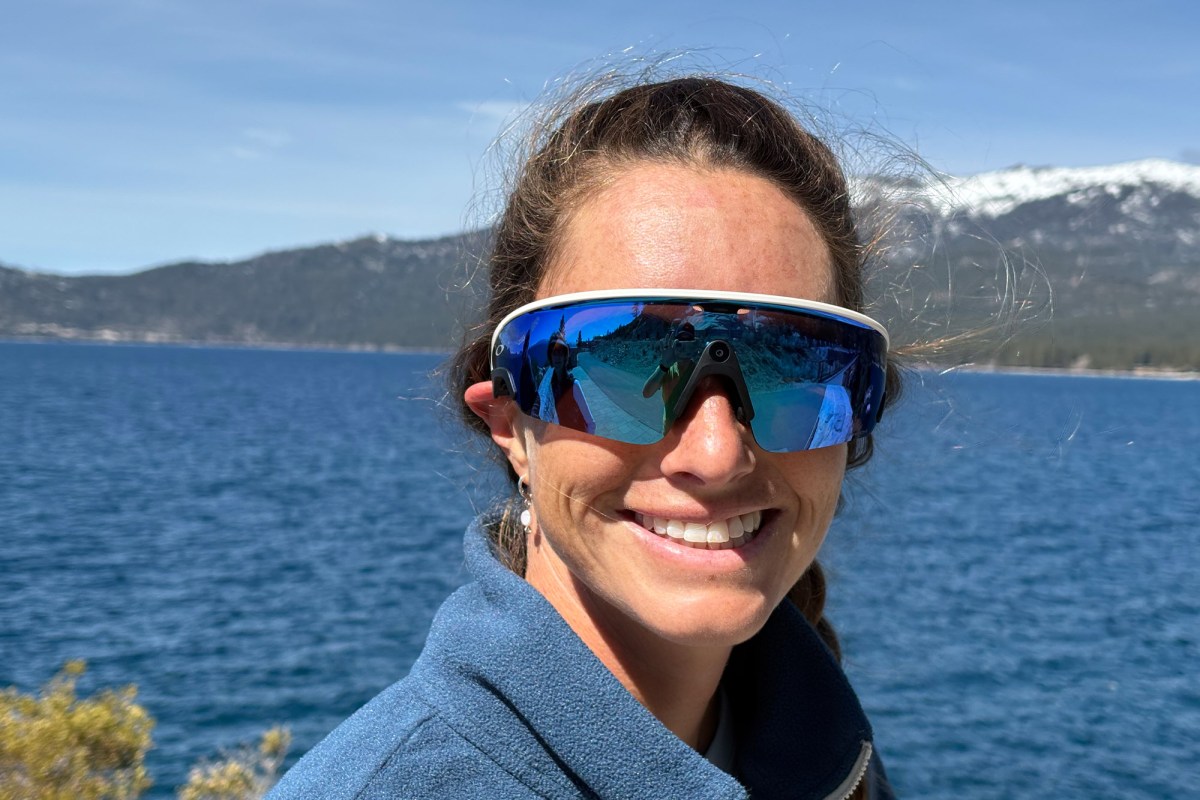 Close-up of Oakley Meta AI glasses worn near a lake