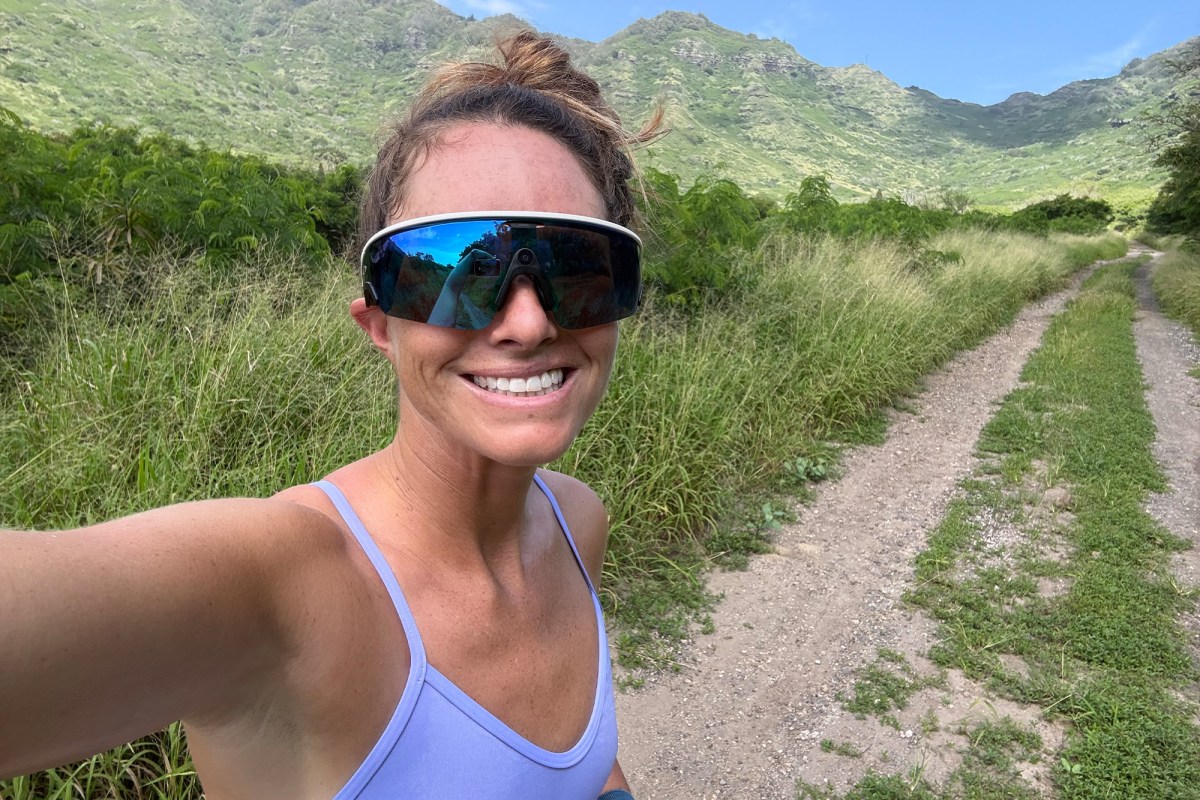 Person wearing Oakley Meta Vanguard glasses on a trail