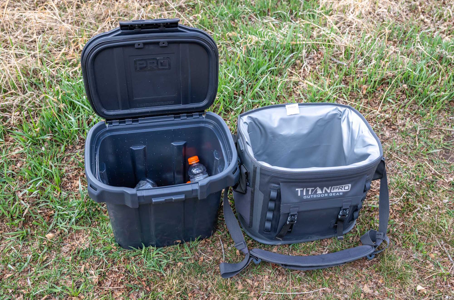 Open Titan PRO cooler next to its removable liner, showing plastic drink bottles inside the rigid compartment.