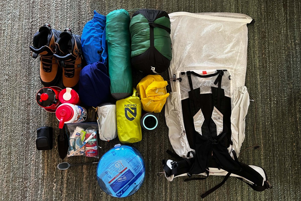Backpacking supplies laid out on floor