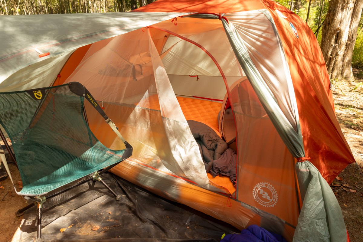 Copper Spur UL3 tent with rainfly open showing vestibule and gear outside
