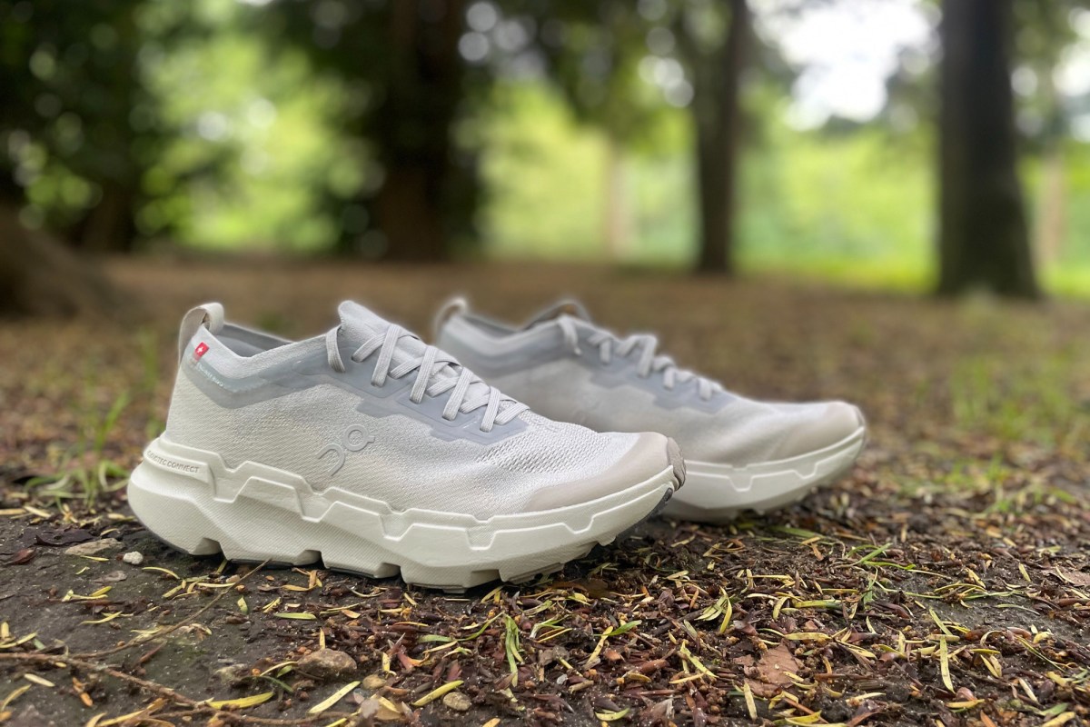 On Cloudsoma trail shoes on a wooded trail with a low-cut upper and thick outsole