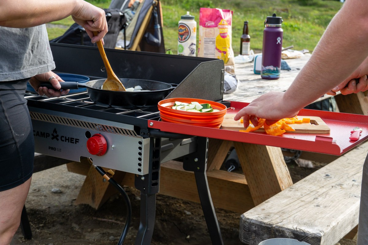 gearjunkie testers prep food and cook on the camp chef pro 14 camp stove at a frontcountry site in washington state