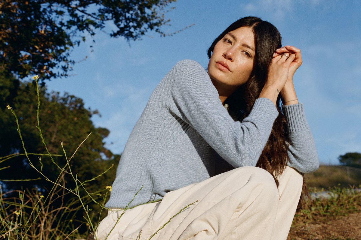 Woman wearing PAKA sweater