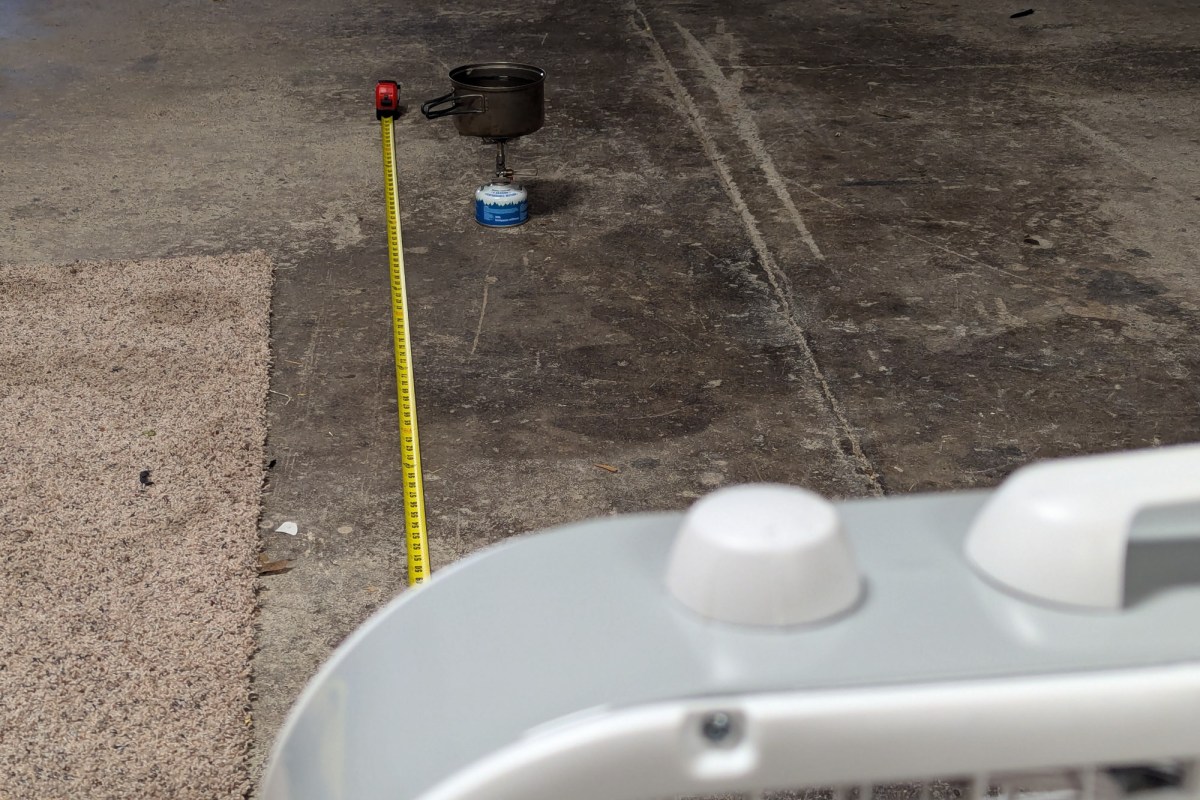 the soto windmaster stove boils a pot of water 10 feet from a box fan to test its wind-resistance and fuel consumption in less-than-ideal conditions
