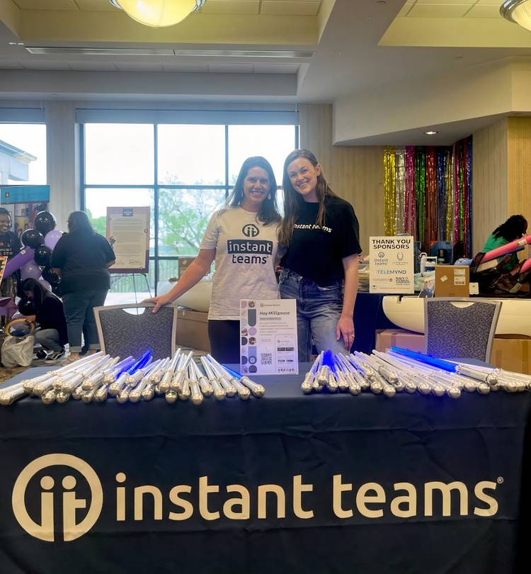 Instant Teams co-founder Erica McMannes with an unidentified staff member at a recent community event (Erica McMannes).