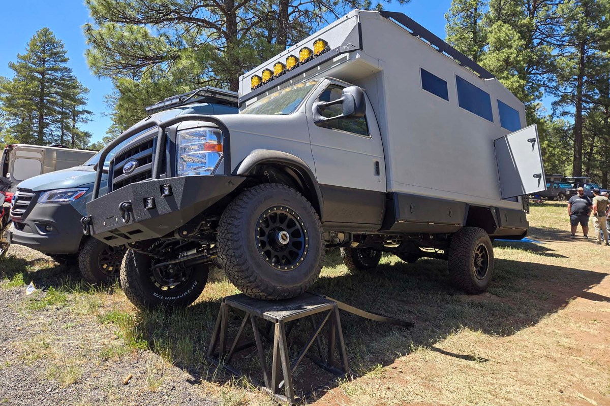 Gray Field Van overland camper displayed at an outdoor event