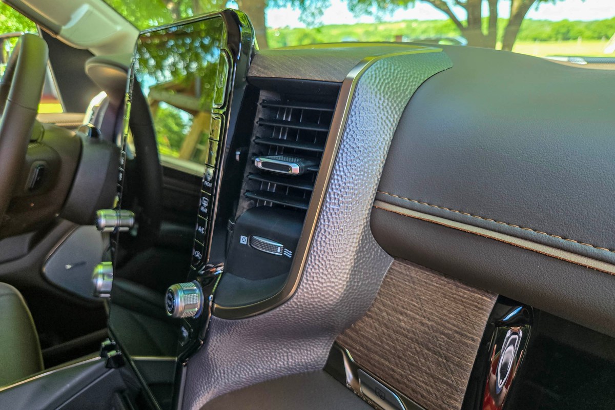 Close-up of Ram Longhorn dashboard with hammered metal trim and wood accents