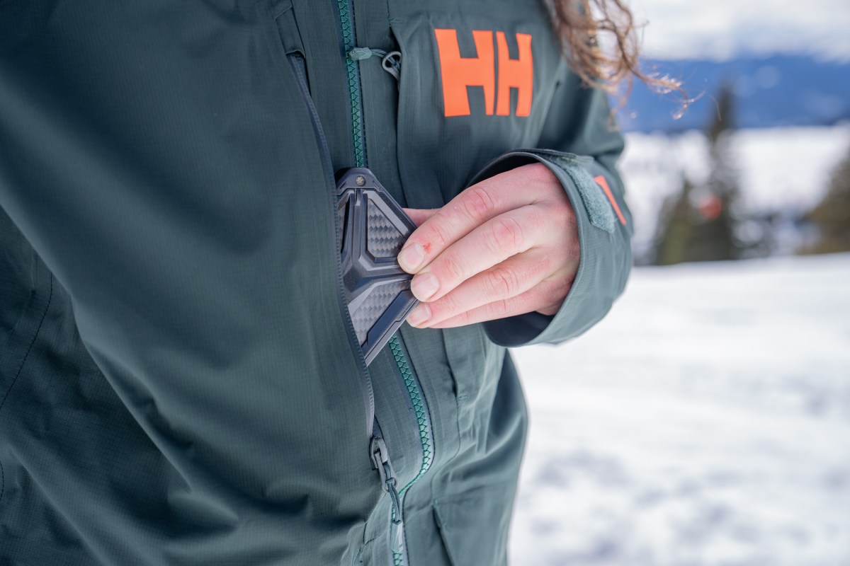 Close-up of the Ridge Infinity Jacket 2.0 chest pocket holding a small device