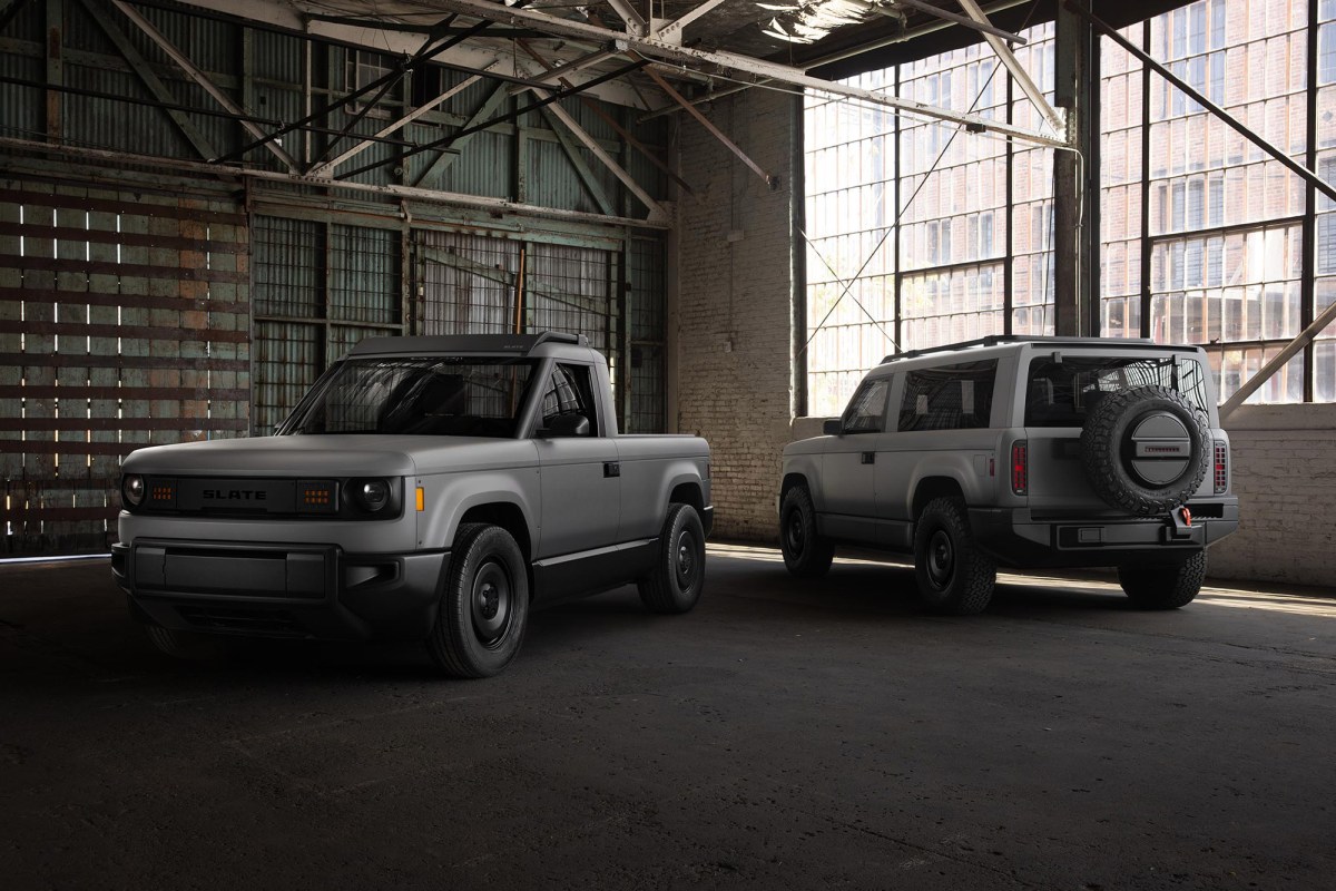 Slate pickup and SUV parked inside an industrial warehouse