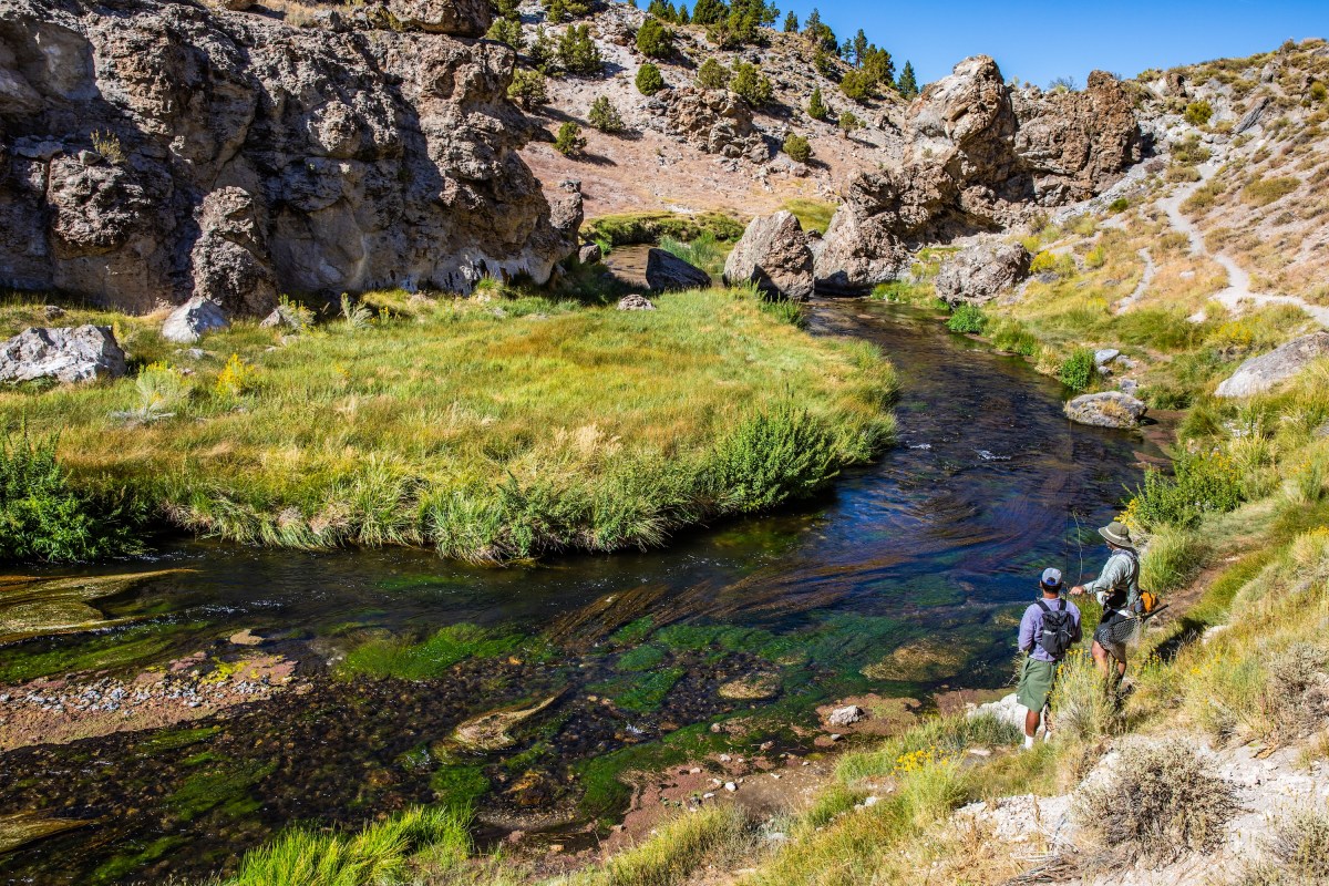 Two people fly fishing on Hot Creek