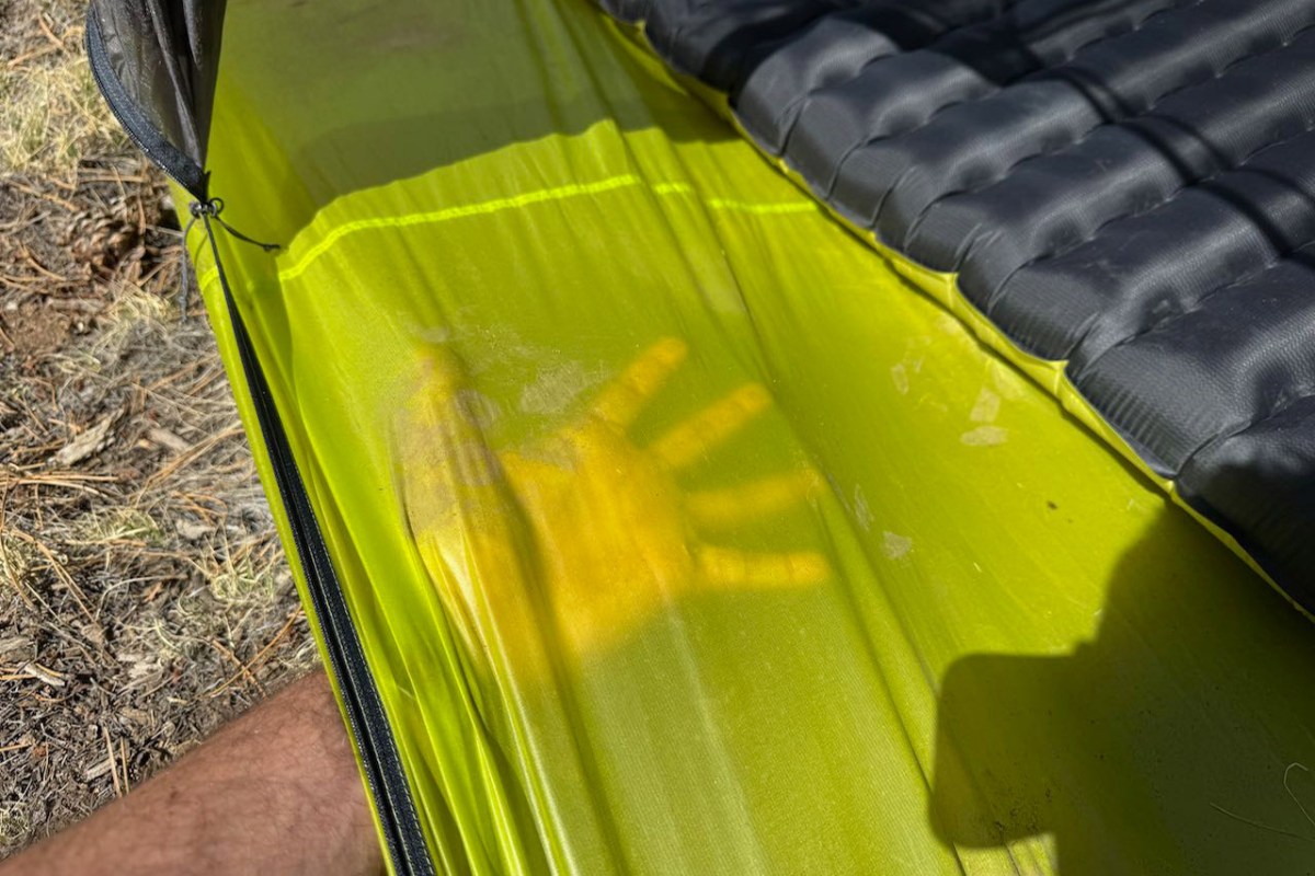 Close view of the Tiger Wall UL2 tent floor beside a black sleeping pad