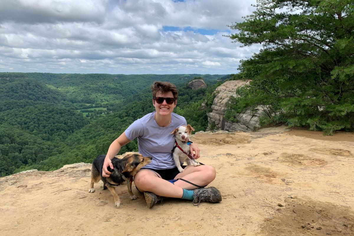 person with two dogs
