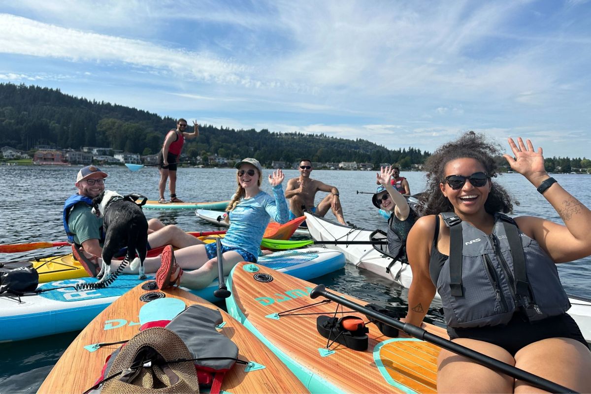 group of paddleboarders on a lake