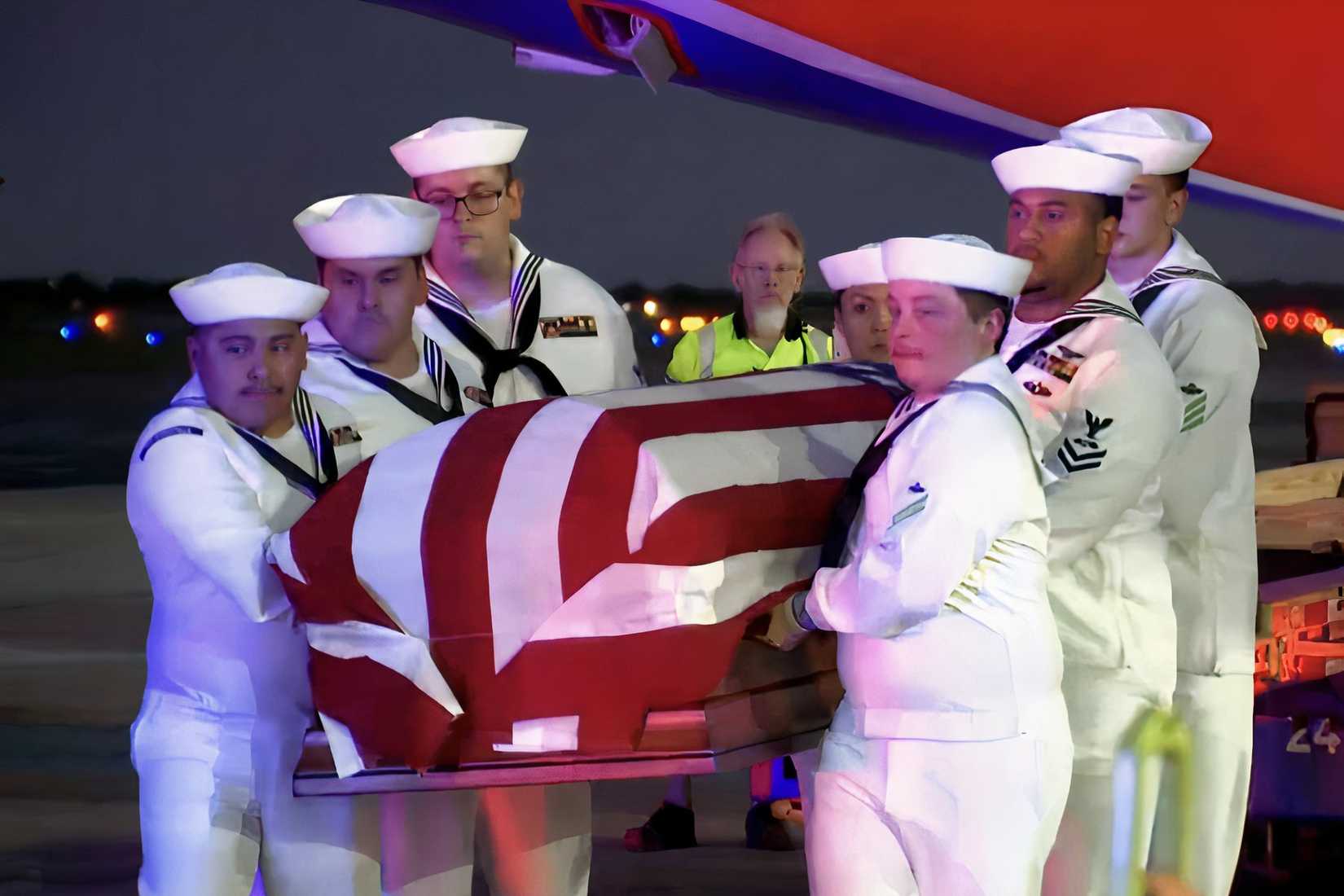 Sailors carry the flag-draped casket of Navy Seaman Angelina Resendiz during funeral services.