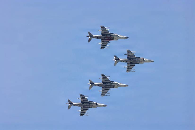 A fleet of AV-8 Harrier jets flying high above Marine Corps Air Station Cherry Point in NC. (U.S. Marine Corps).