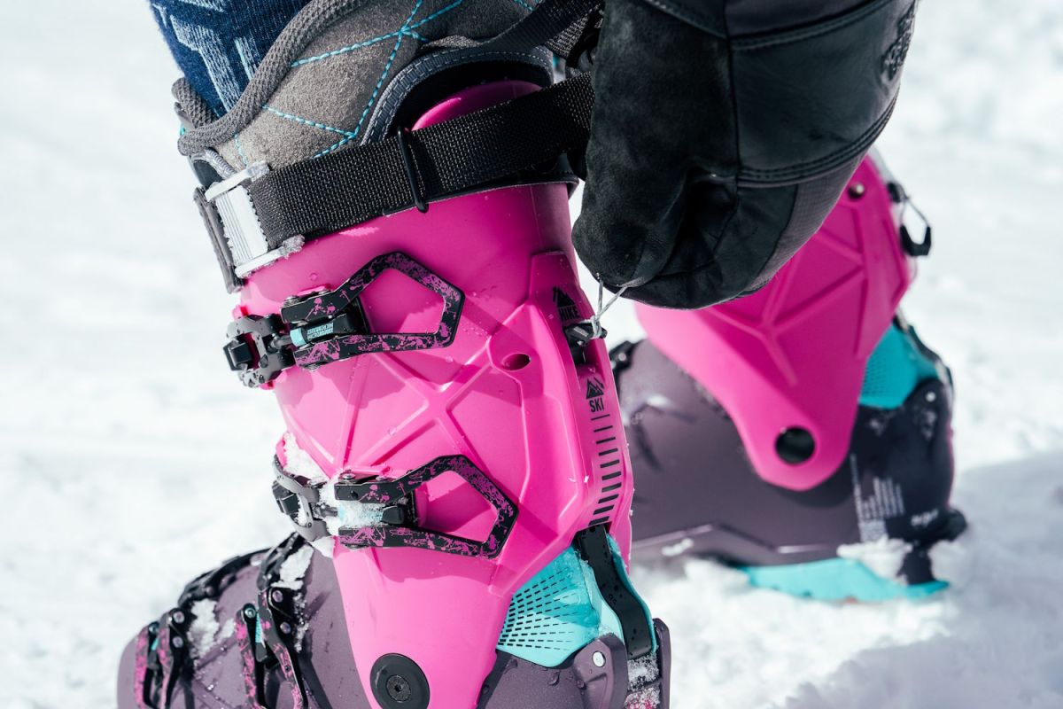 Close-up of skier switching hike to ski mode on Rossignol AllTrack 130 Elite LV LT Ski Boots