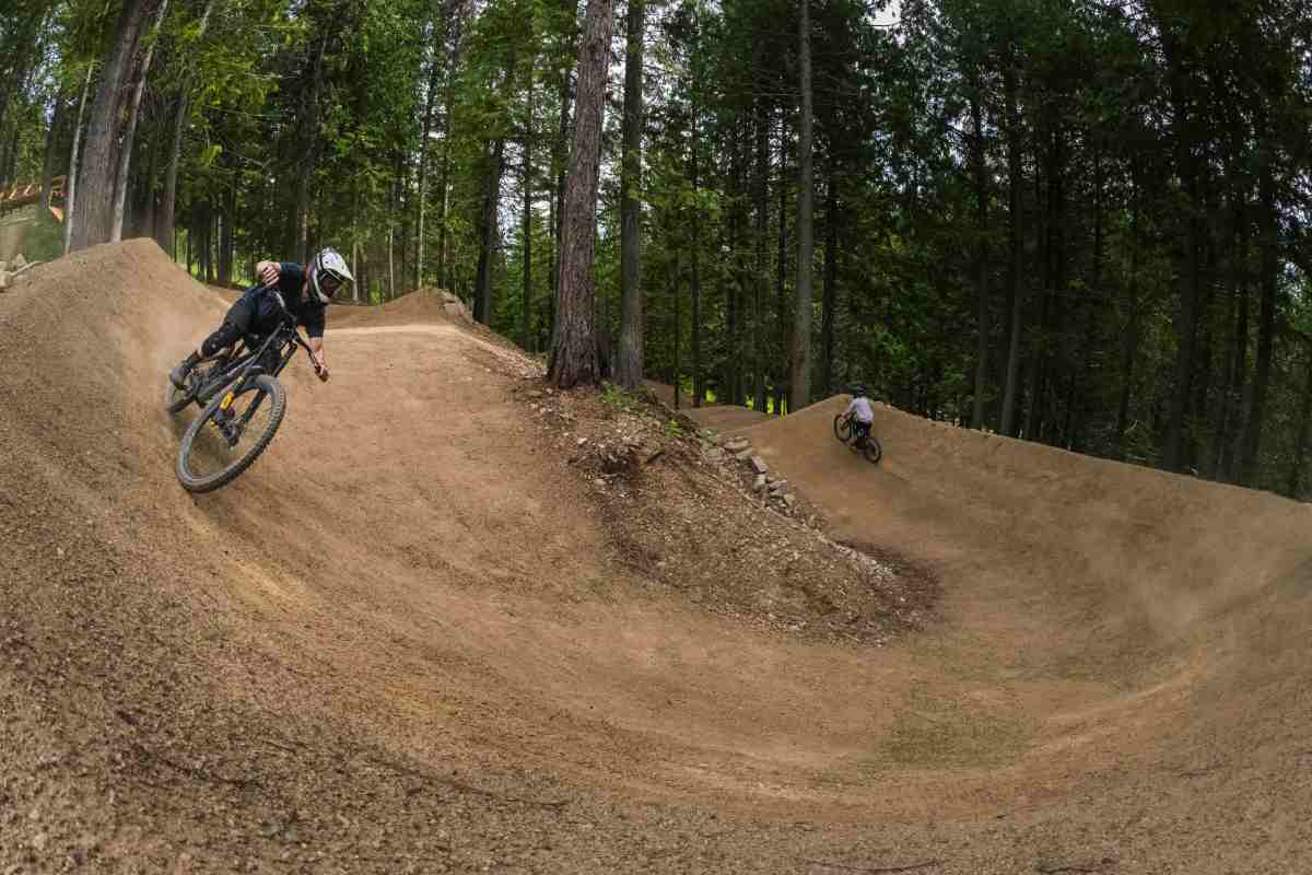 “The features were inspired by the terrain's original shape and pushing the boundaries of scale, size, and dynamic-ness,” said GL trail designer and project manager Dane Tudor (right); Sweet Protection ambassador Max Nutini (left); photo/Ashley Voykin