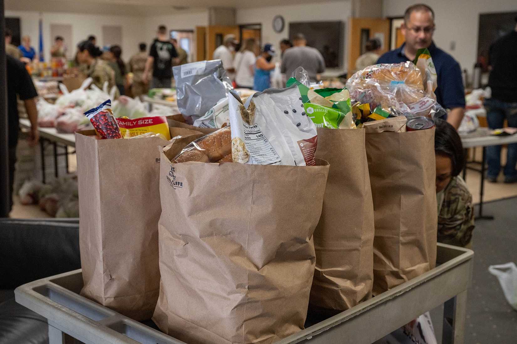Defense Department members volunteer at a mobile food pantry at the chapel on Hurlburt Field, Florida.