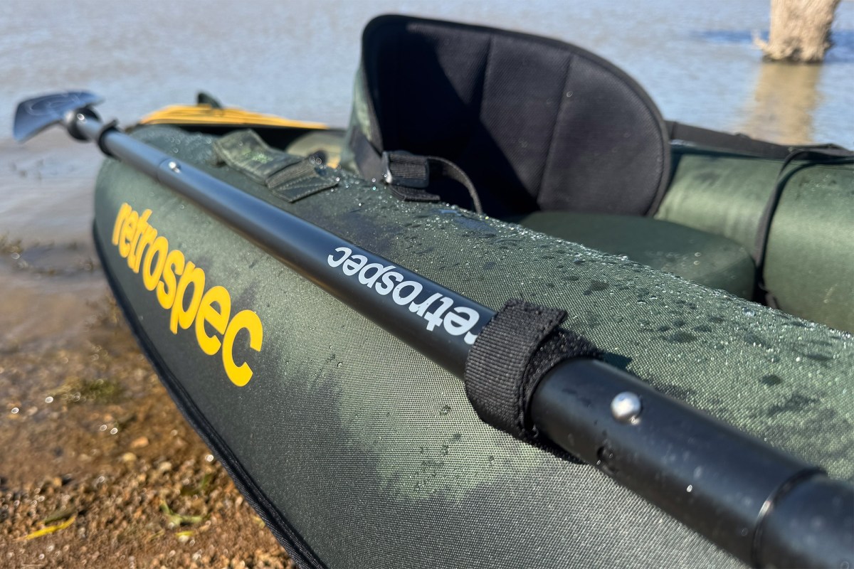 Close-up of a Retrospec paddle clipped to the side of the kayak