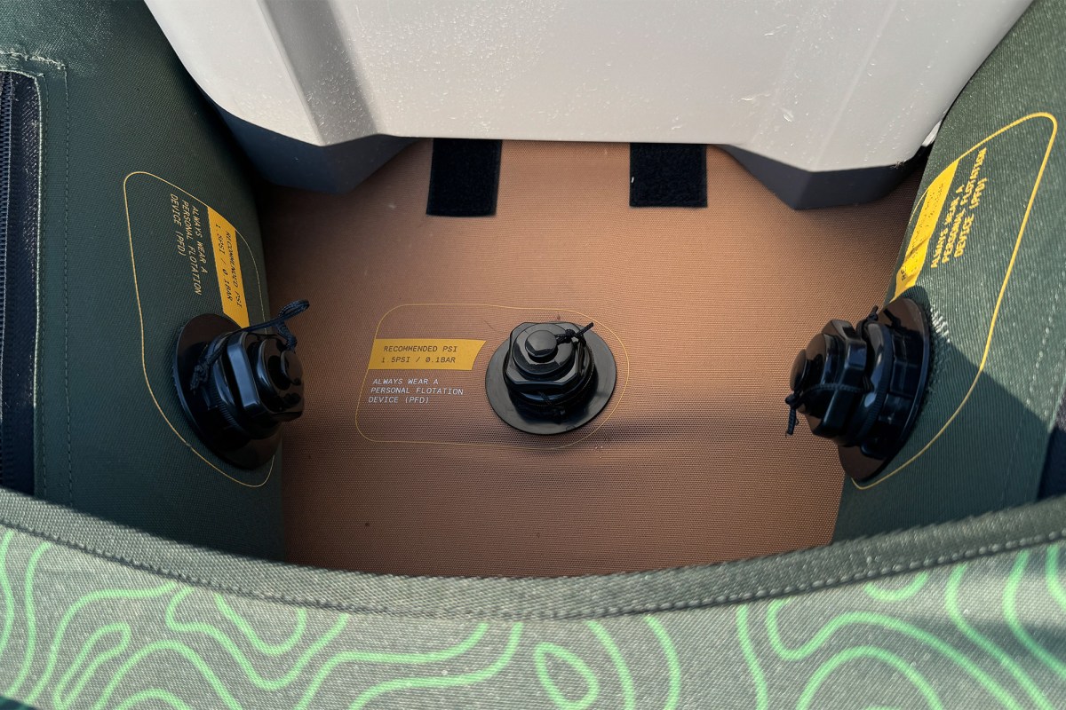 Close-up of the Coaster kayak floor, inflation valves, and cooler base