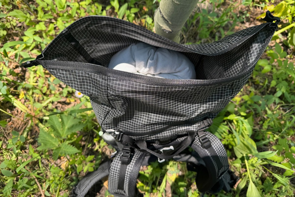 Open roll top compartment on the Exped Lightning 50 backpack