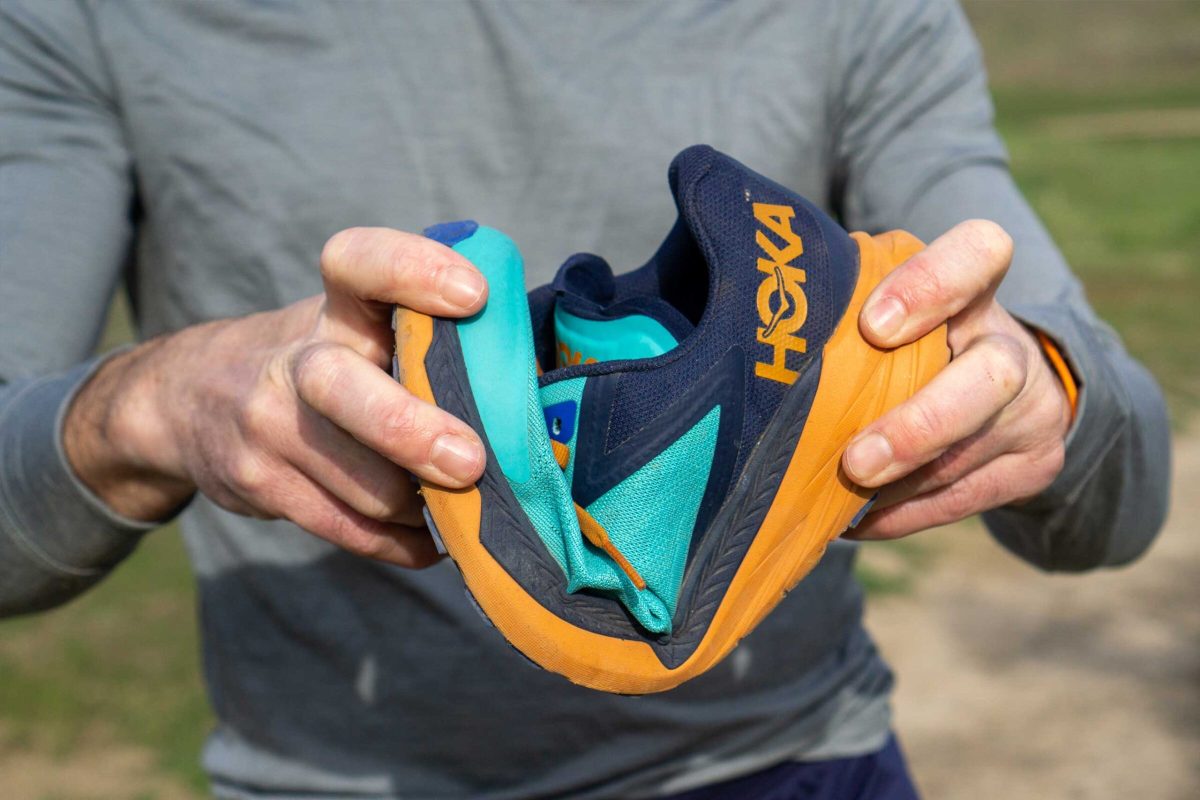 Flexing a trail running shoe to demonstrate its importance