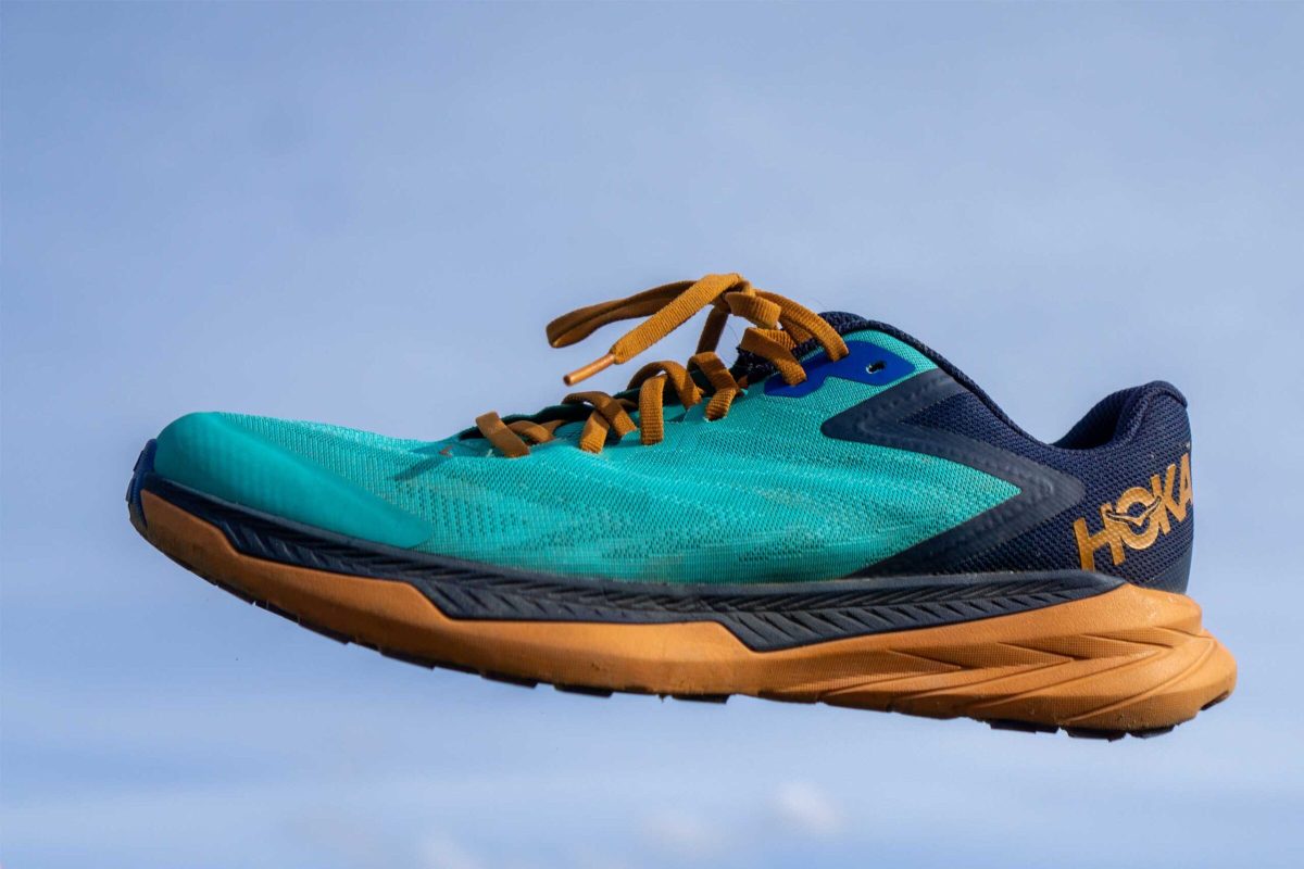 Close up of a trail running shoe in the air to show lightweight option 
