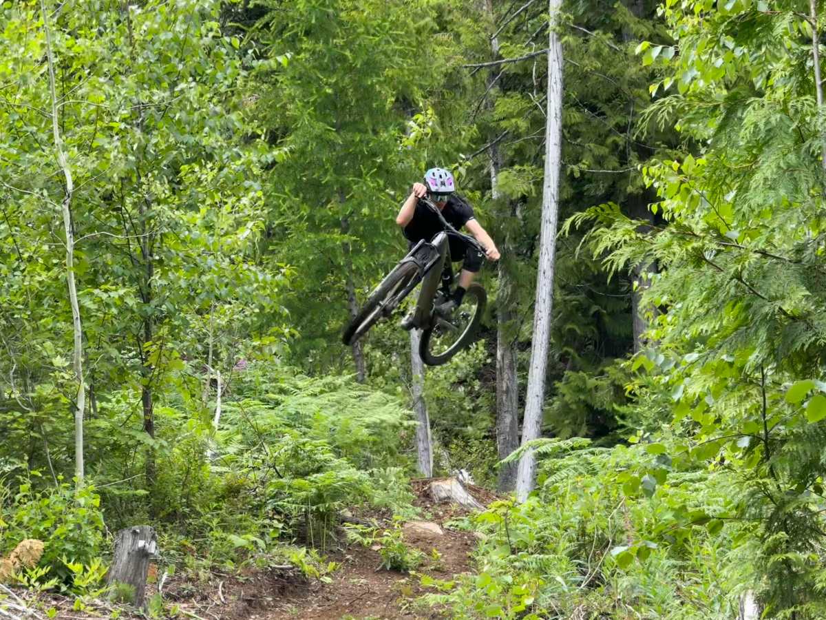 Athlete Dane Tudor boosting a trail step down on the Levo 4 EVO Pro e-mountain bike; (photo/Morgan Tilton)