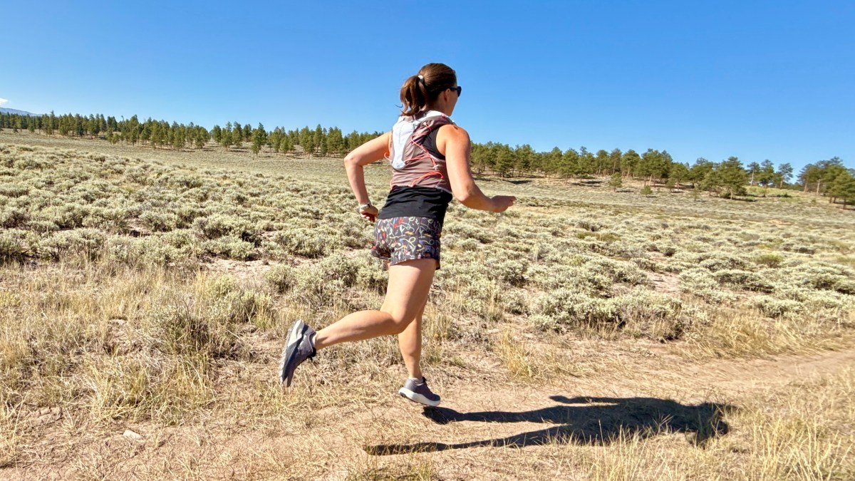Woman trail running in the Salomon Pulsar