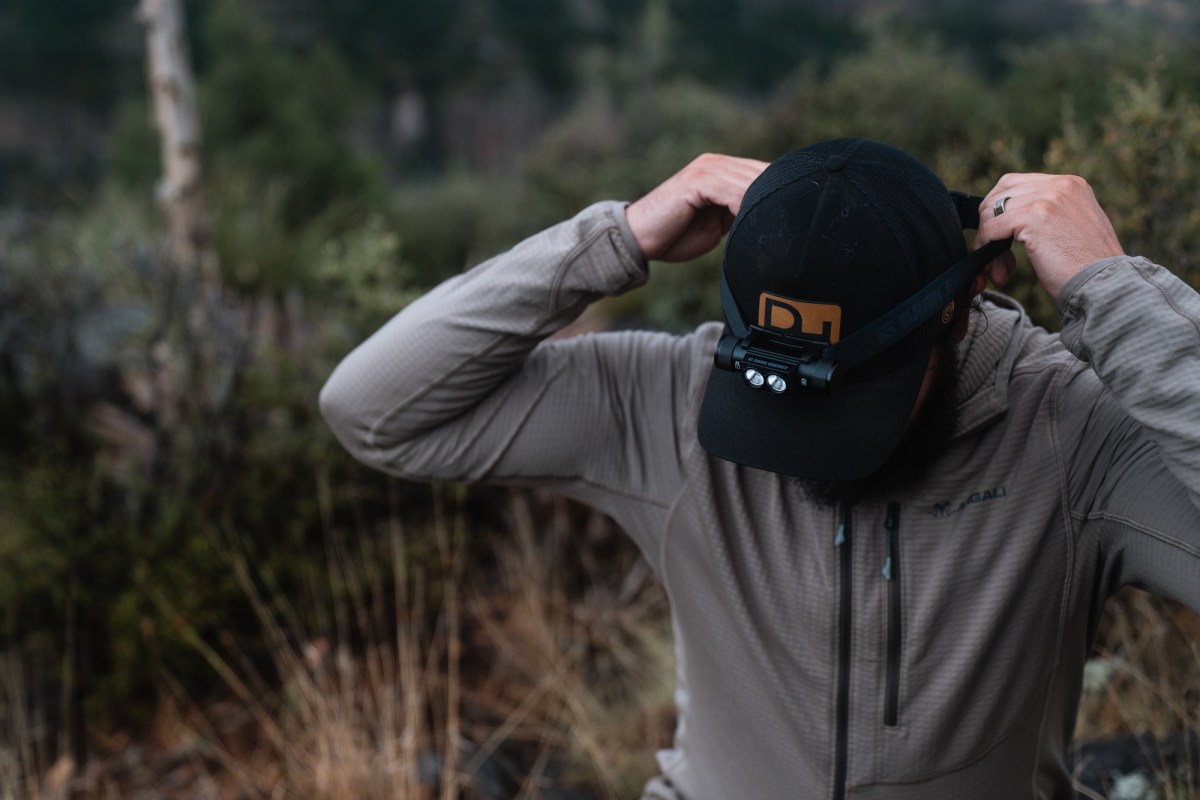a man wearing the Dark Energy Oracle Headlamp