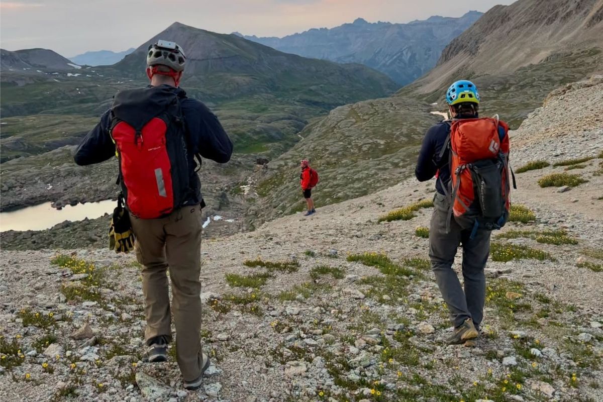 rear view of two men in mountaineering gear
