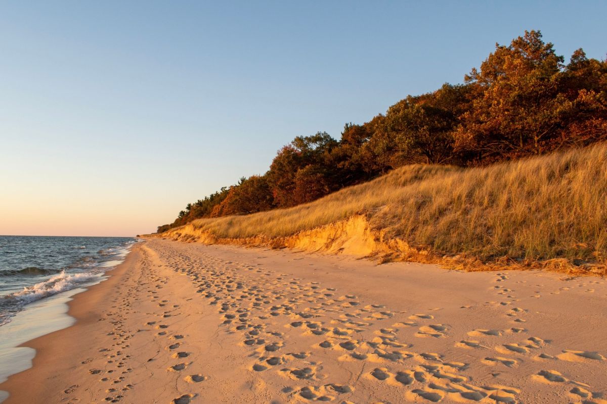 beach on lake with footprints