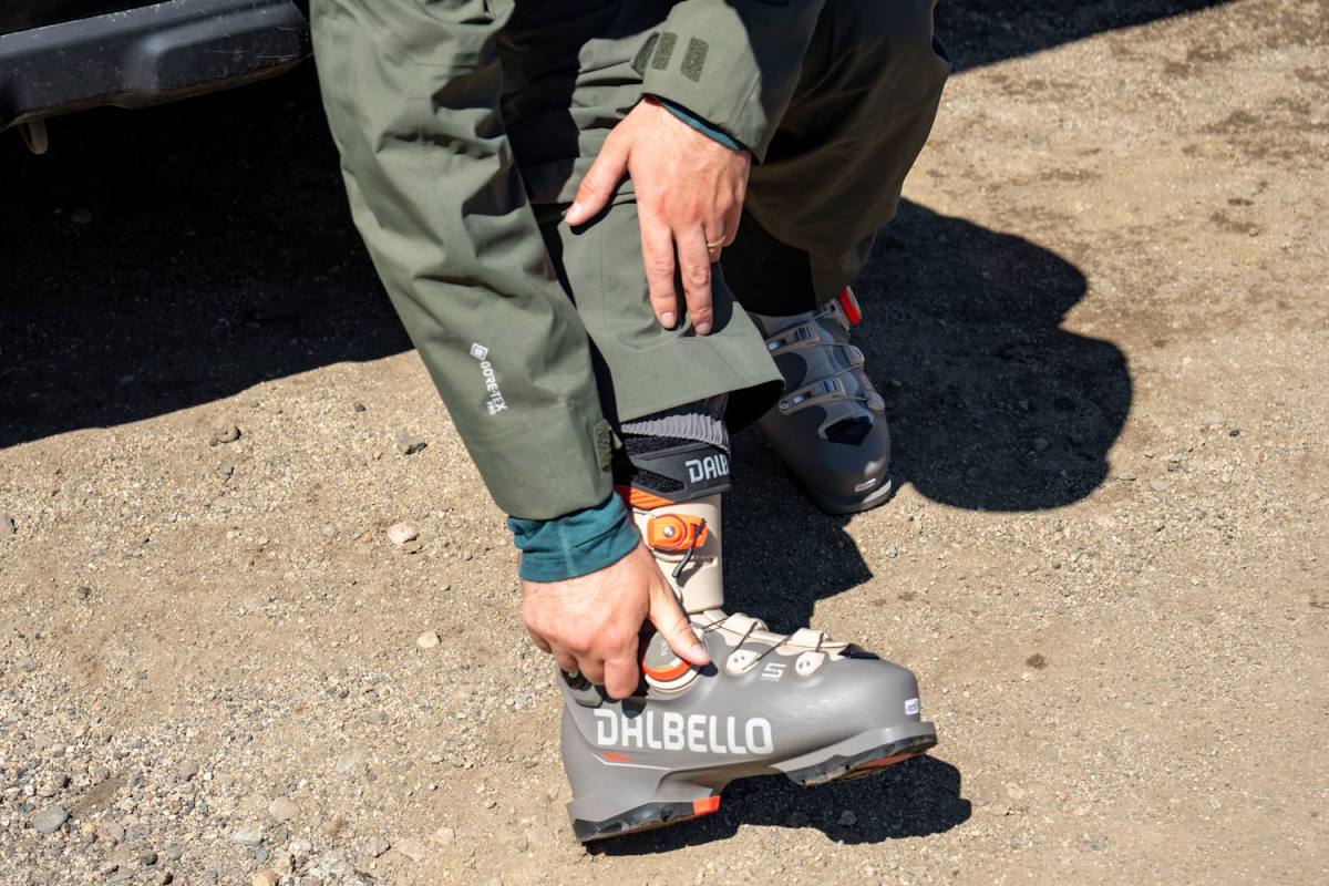 Skier tightening BOA dial on Dalbello Veloce Space ski boot