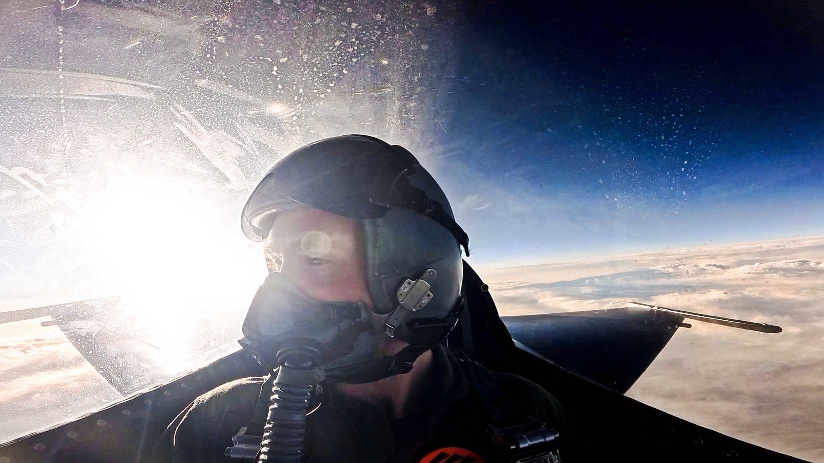 Louis Skupien sits in the back seat of a U.S. Air Force F-16D above the clouds during his Edwards Air Force Base documentary flight.