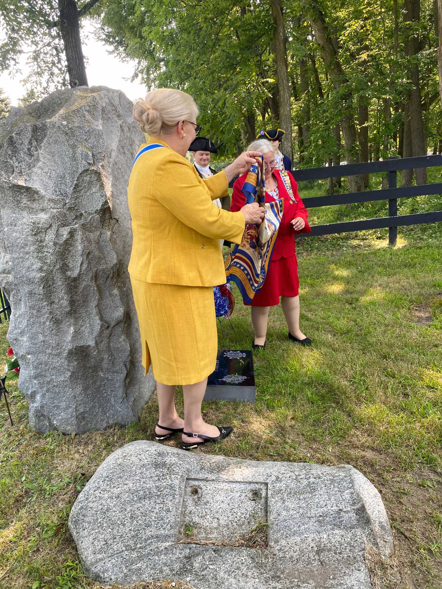 Elaine Sholty, Indiana State Regent of the National Society of Daughters of the American Revolution, speaks at grave marker ceremony for William Tufts (Kistin Harris/Boston Tea Party Ships & Museum).