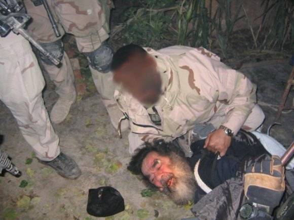 Saddam Hussein is found hiding in a small hole.