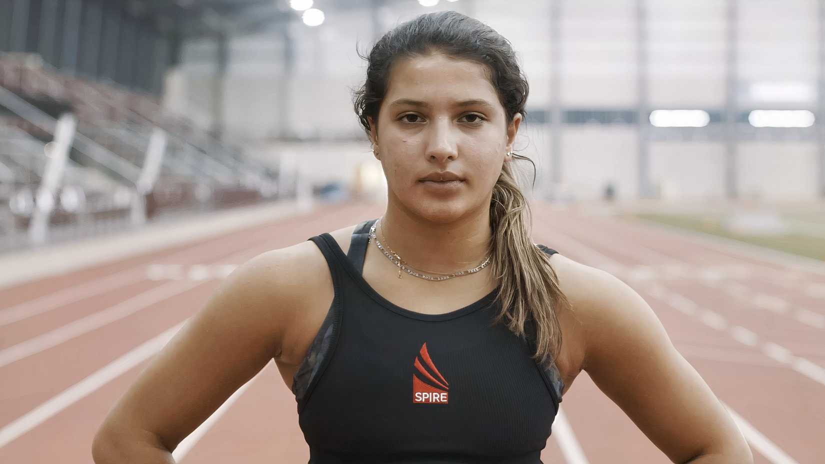 A student athlete stands inside the indoor track facility at SPIRE Academy in Geneva, Ohio.