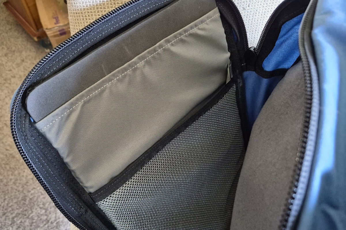 Padded laptop sleeve and mesh pocket inside the Hill People Gear Commuter