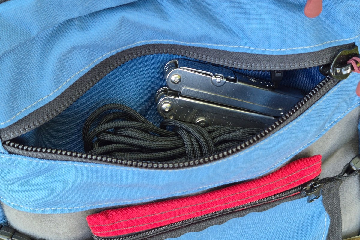 Multitool and cord stored in the Hill People Gear Commuter front pocket