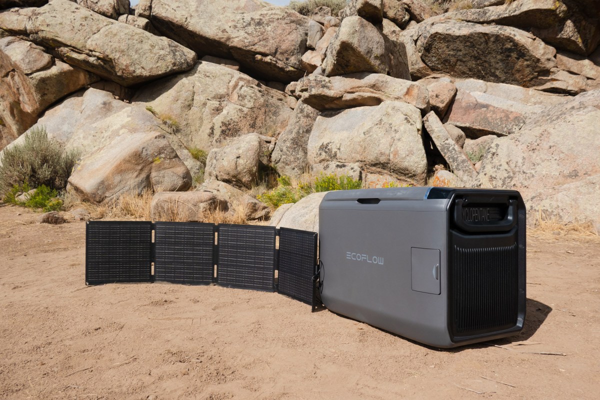 GLACIER Classic 45L portable fridge charging from a folding solar panel