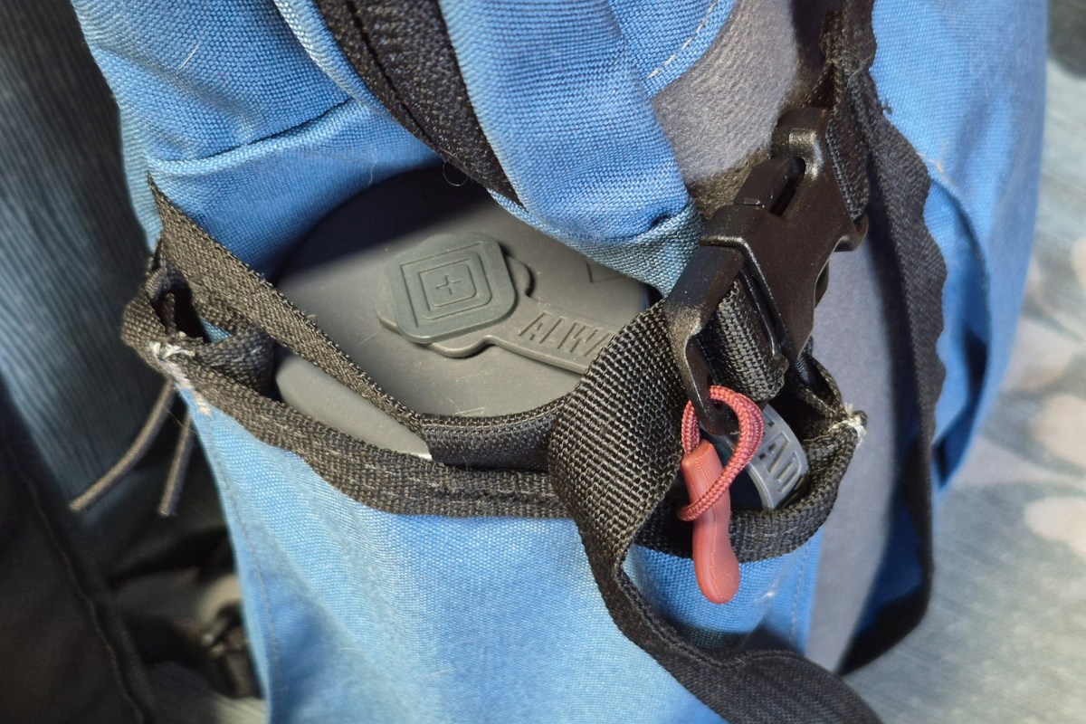 Compact case secured in the Commuter pack side pocket with a compression strap
