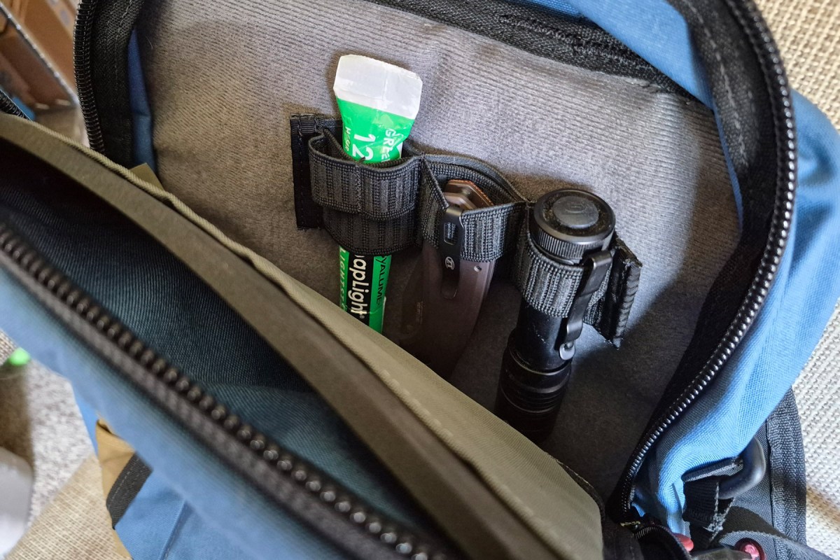 Flashlight and small tools secured inside the Commuter pack