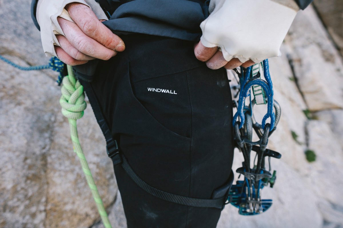 WindWall fabric panel on The North Face climbing pants under a harness