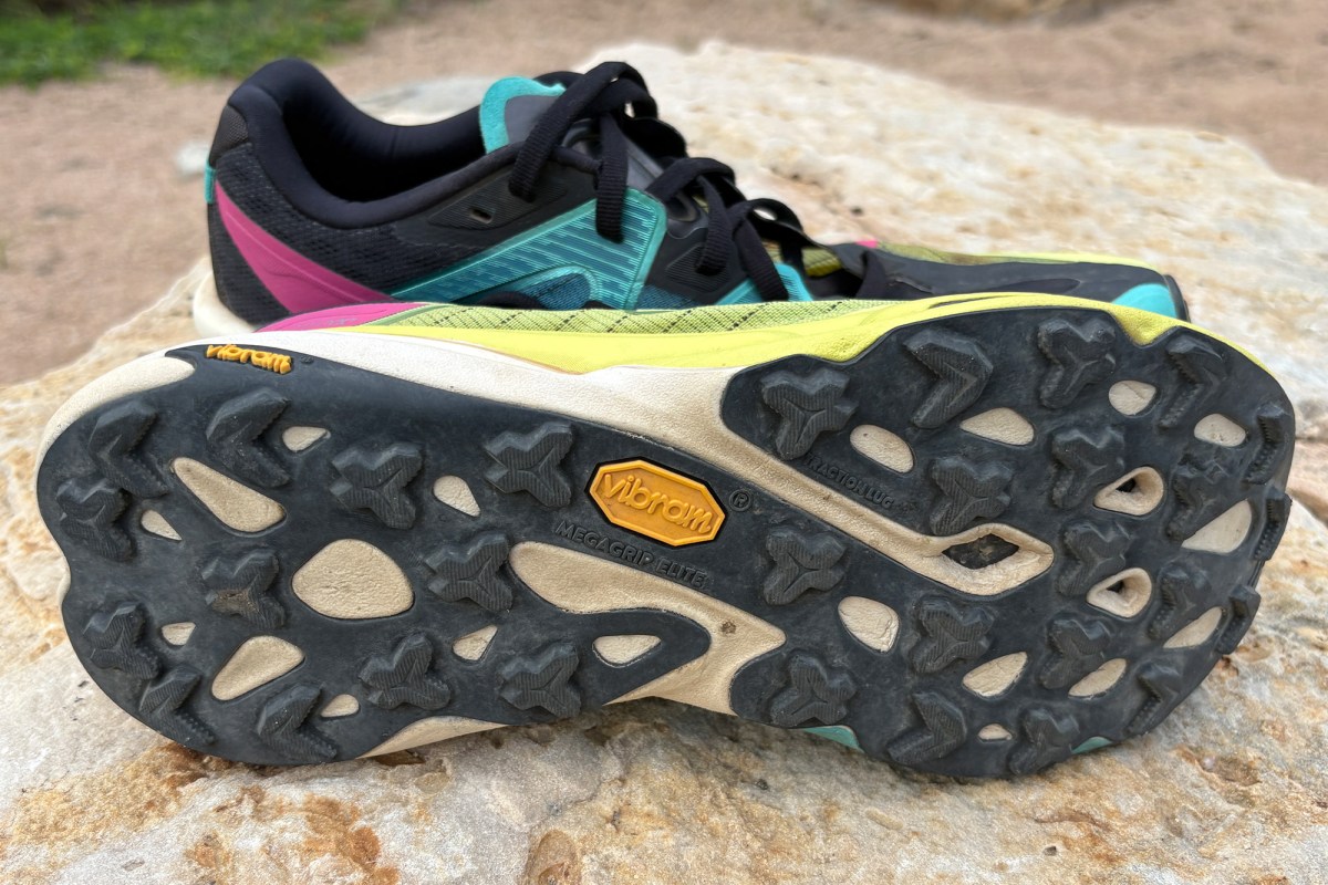 Close view of the Vibram Megagrip outsole and trail lugs