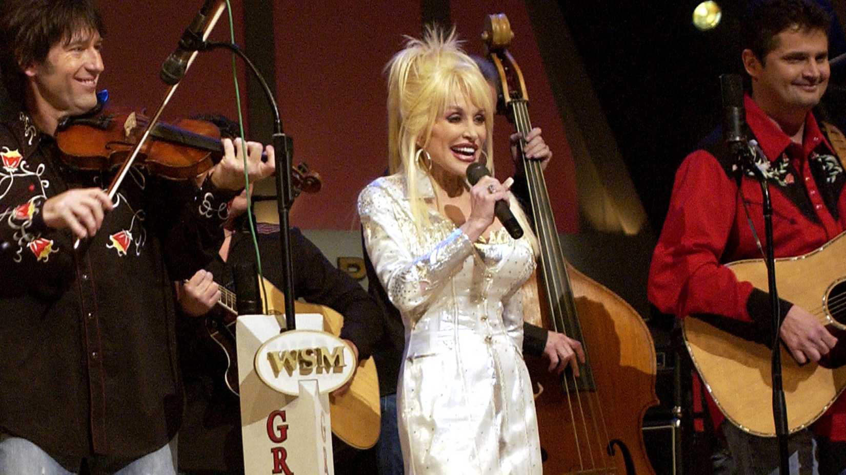 DollyonStageGrandOlOpryCountry star Dolly Parton sings on stage during a Grand Ole Opry live broadcast in Nashville, Tenn., April 23 as U.S. soldiers watch the show via a video feed in Iraq.
