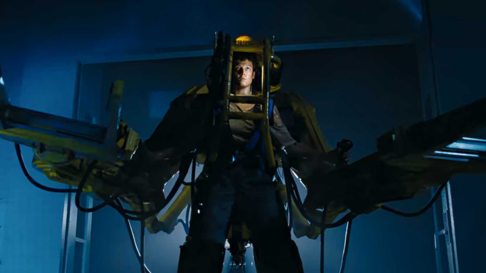 Sigourney Weaver as Ellen Ripley operating a large mechanical power loader in the 1986 science fiction film Aliens.